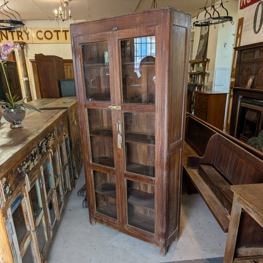 Tall Glazed Teak Cupboard